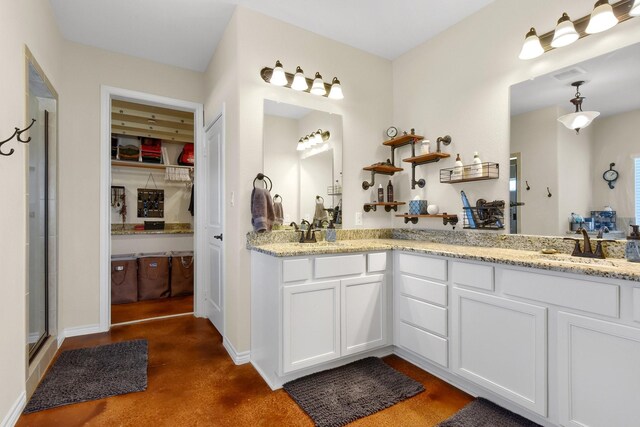 bathroom featuring vanity, walk in shower, and concrete floors