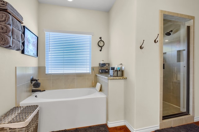 bathroom with independent shower and bath