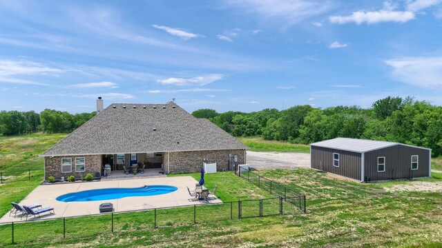 view of pool with a yard and a patio area