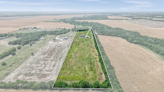 birds eye view of property with a rural view