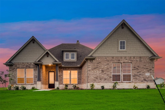 craftsman inspired home featuring a yard