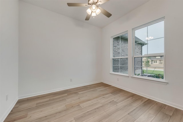 spare room with ceiling fan and light hardwood / wood-style flooring