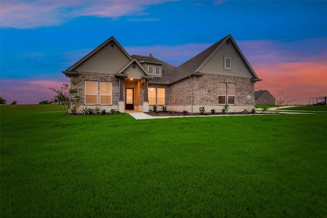 craftsman house with a lawn