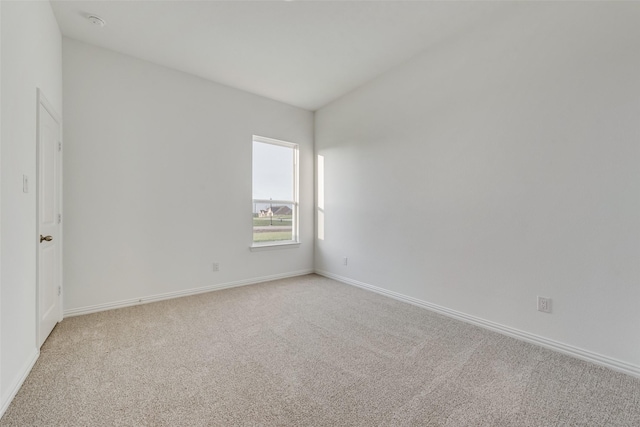 spare room featuring carpet floors