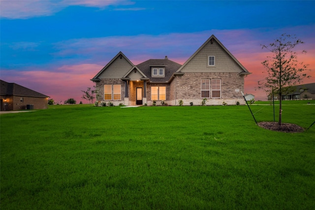 craftsman-style house with a lawn