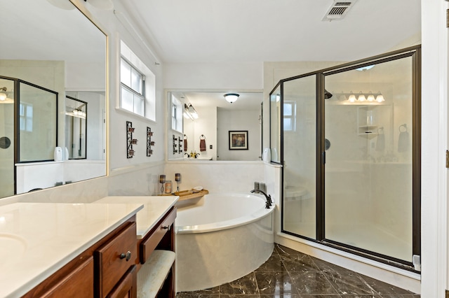 bathroom with independent shower and bath, vanity, and tile patterned floors