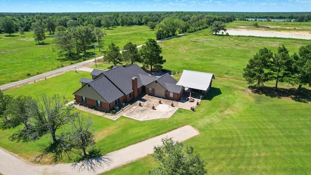 birds eye view of property featuring a rural view