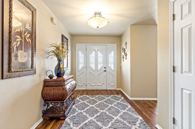 foyer with dark hardwood / wood-style flooring