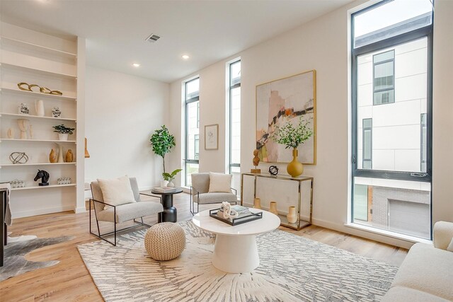 sitting room with light hardwood / wood-style floors