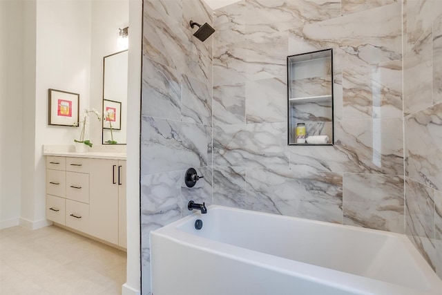 bathroom with vanity and tiled shower / bath