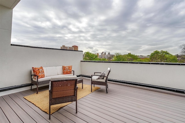 wooden deck featuring an outdoor living space