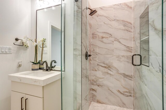 bathroom featuring vanity and walk in shower