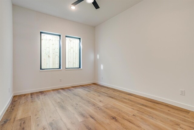 spare room featuring ceiling fan and light hardwood / wood-style floors