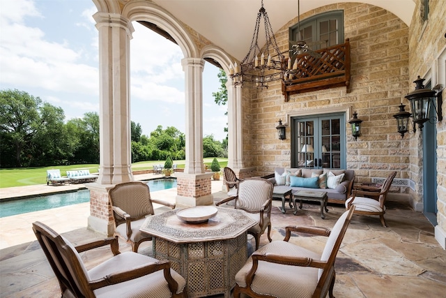 view of patio featuring french doors and an outdoor living space