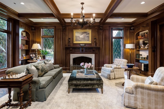 carpeted living room with wooden walls, coffered ceiling, and plenty of natural light