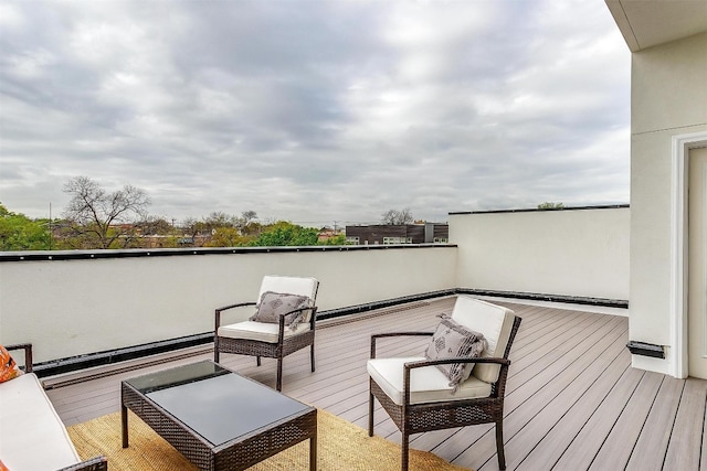 wooden terrace featuring an outdoor hangout area