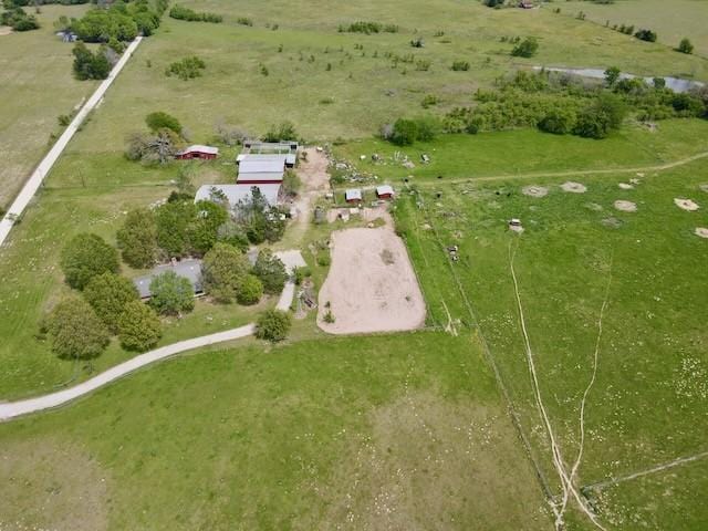 birds eye view of property featuring a rural view