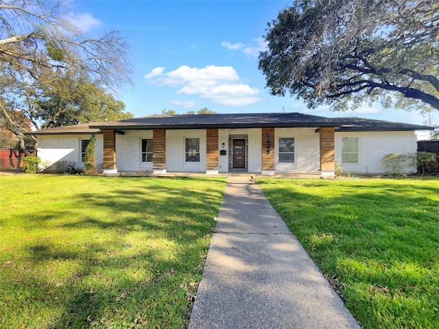 ranch-style house featuring a front lawn