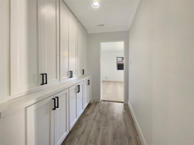 corridor featuring light hardwood / wood-style floors