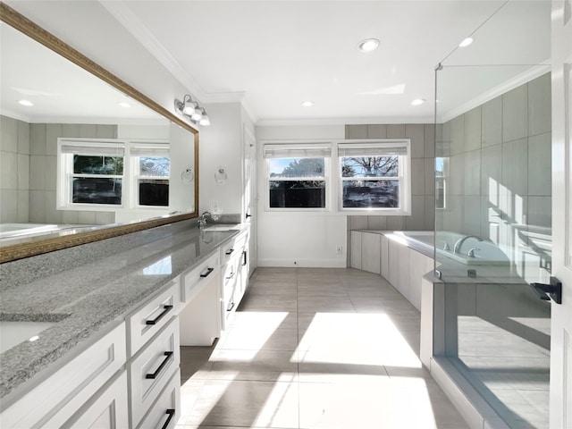 bathroom with tiled bath, tile patterned flooring, ornamental molding, and double sink vanity