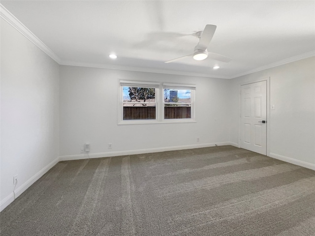 carpeted spare room featuring ceiling fan and ornamental molding