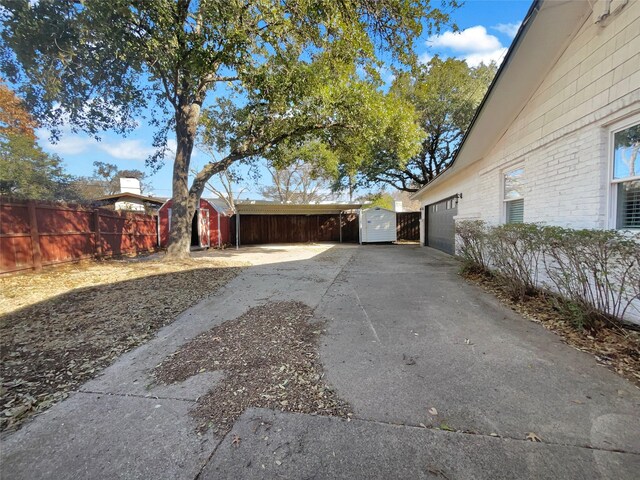 view of side of home featuring an outbuilding