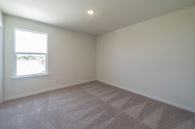 unfurnished room featuring carpet floors