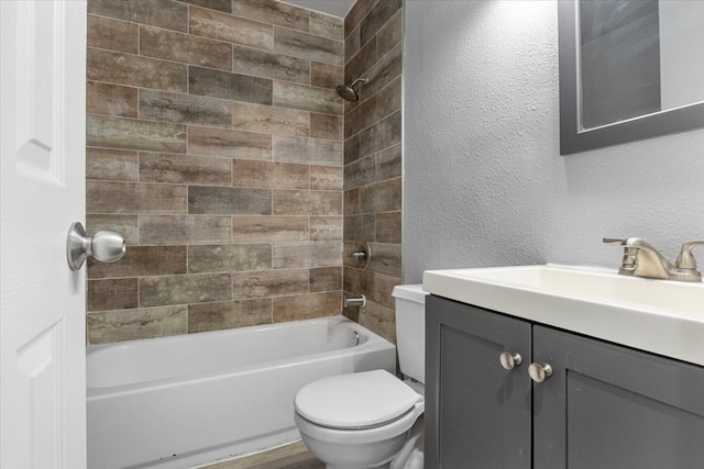 full bathroom with tiled shower / bath combo, toilet, and vanity