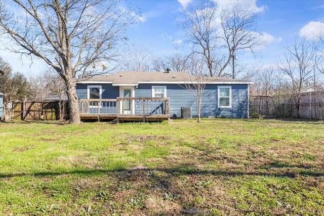 back of house with a yard and a wooden deck