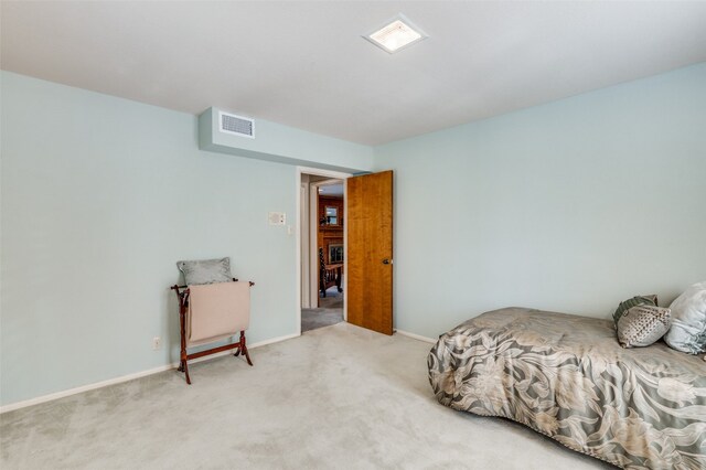 bedroom with light carpet