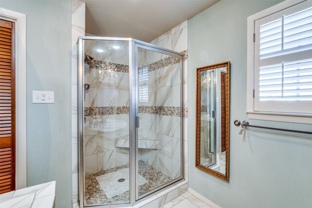 bathroom featuring walk in shower and tile flooring