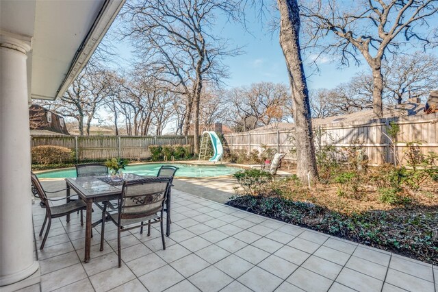 view of patio / terrace featuring a fenced in pool