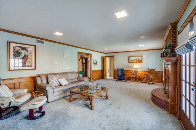 living room with ornamental molding, light carpet, and a fireplace