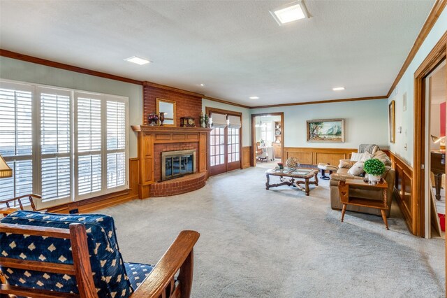 carpeted living room featuring ornamental molding, a brick fireplace, a textured ceiling, and a wealth of natural light