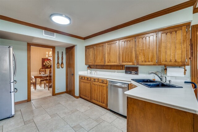 kitchen with light tile floors, ornamental molding, sink, and stainless steel appliances