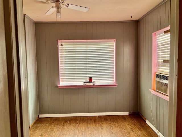 empty room featuring ceiling fan and dark hardwood / wood-style flooring