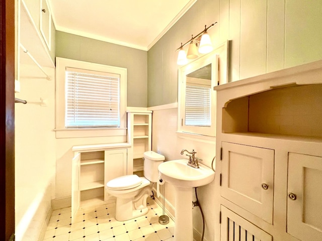 bathroom with sink, tile floors, toilet, and ornamental molding