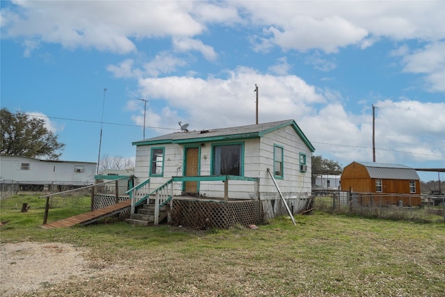 back of house featuring a yard