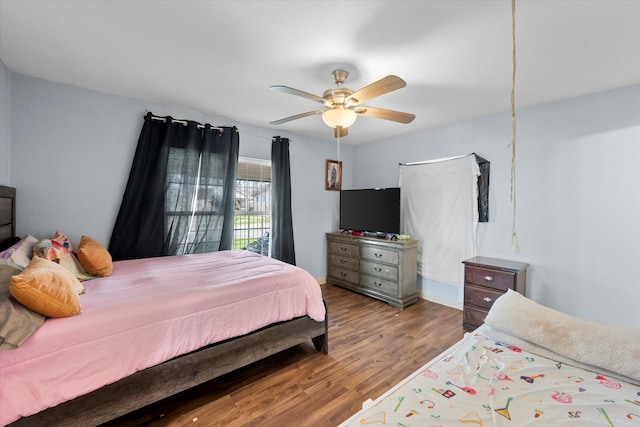 bedroom with ceiling fan and hardwood / wood-style floors