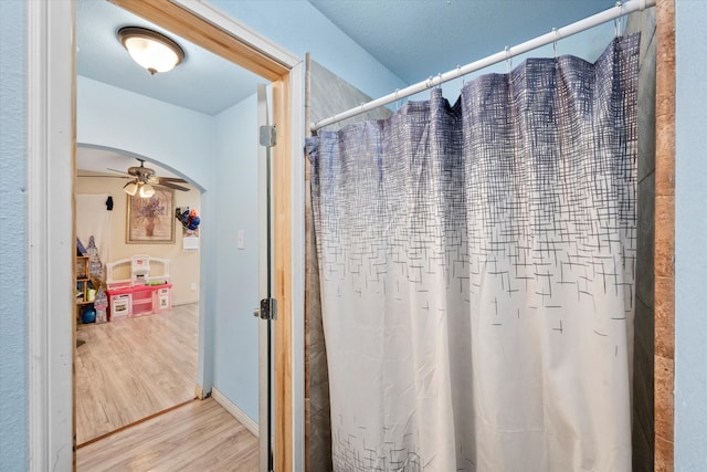 bathroom featuring hardwood / wood-style floors and ceiling fan