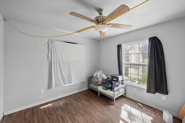 living area featuring ceiling fan and hardwood / wood-style flooring