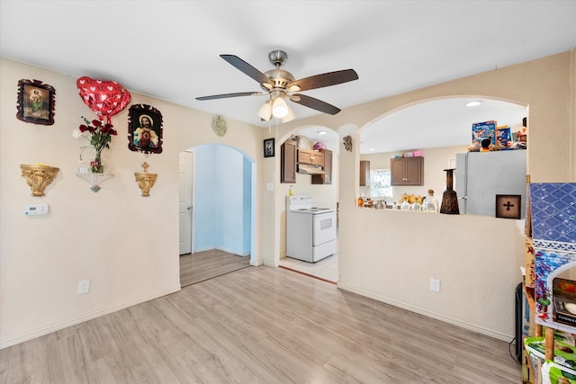 interior space with light hardwood / wood-style floors and ceiling fan