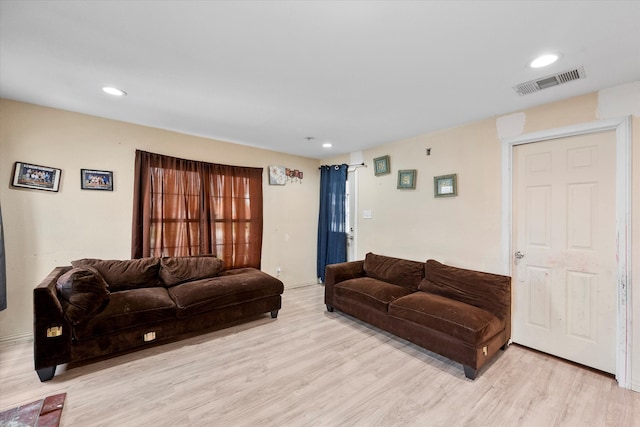 living room with light hardwood / wood-style flooring