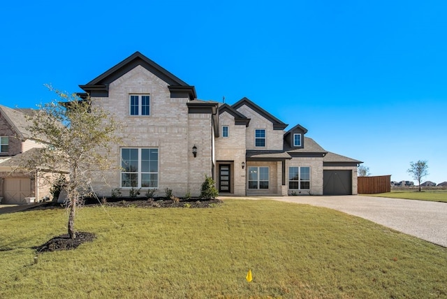 view of front facade with a front yard and a garage