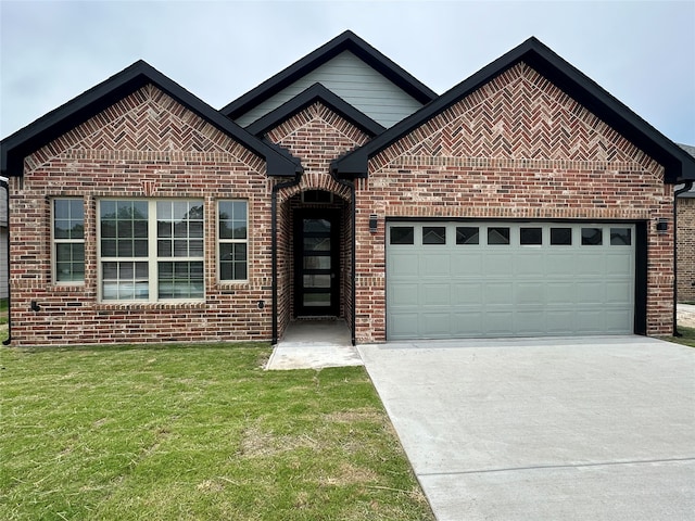 view of front of house featuring a front yard and a garage