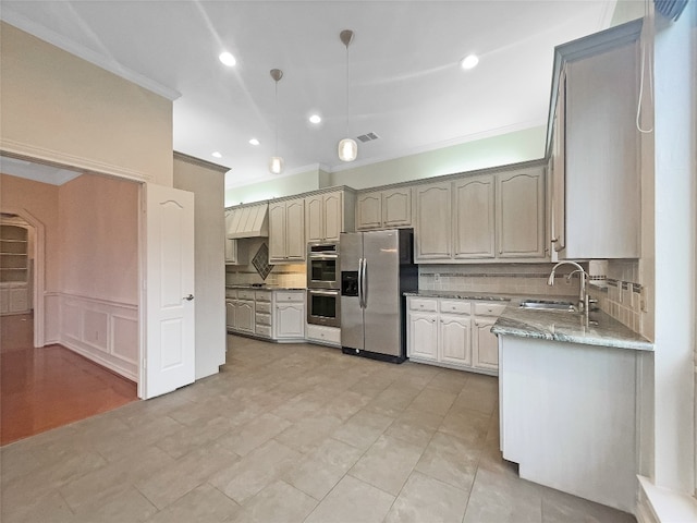 kitchen featuring light stone countertops, backsplash, sink, stainless steel appliances, and light tile floors