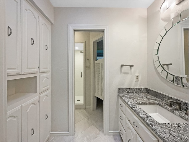 bathroom featuring large vanity and tile floors