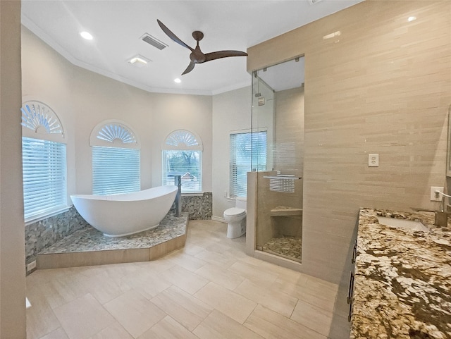 full bathroom with independent shower and bath, ceiling fan, tile floors, toilet, and ornamental molding