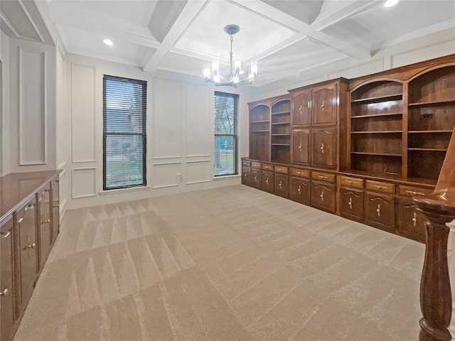 interior space with coffered ceiling, an inviting chandelier, light colored carpet, and beamed ceiling