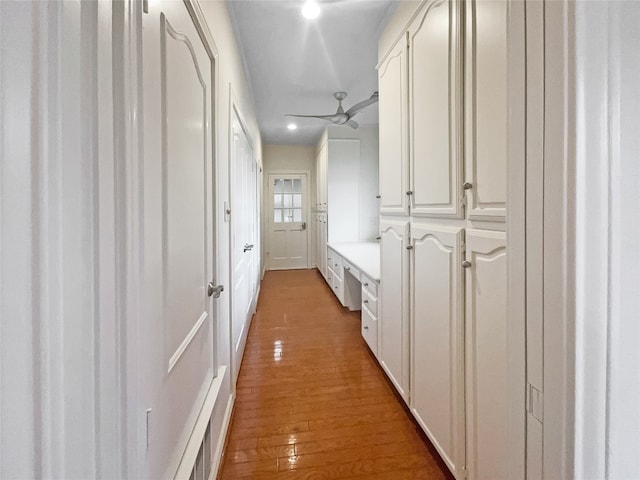 corridor with light wood-type flooring